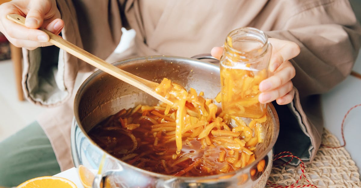 Can I import honey to Norway? - Person Holding Clear Glass Mug With Brown Liquid