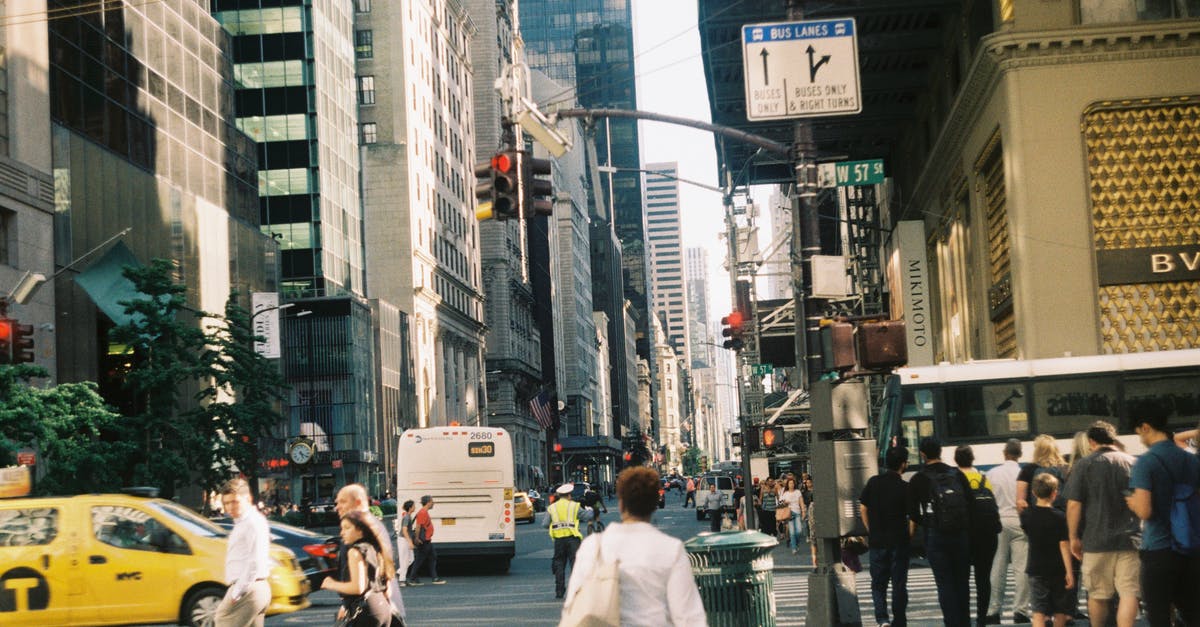 Can I leave the transit area during an EU+Schengen layover? - People walking in busy modern city