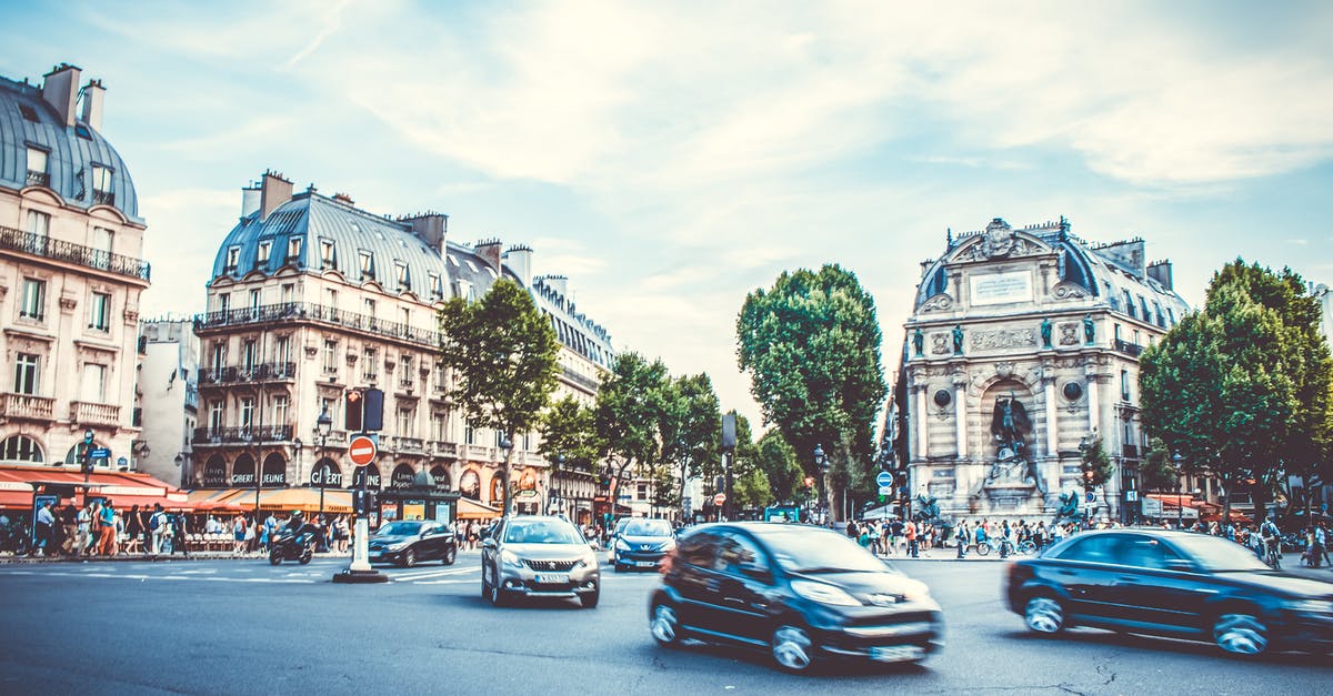 Can I legally drive in France with an Indian driving licence? - Group of Cars Running on Gray Pavement