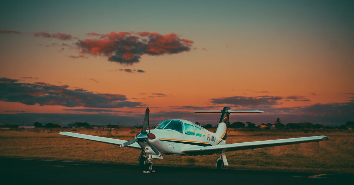 Can I "park" the value of a non-refundable airline ticket? - Small airplane on airfield in countryside against sundown sky