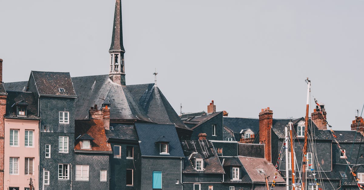 Can I re-enter France with my recipisse de demande de carte de séjour? - Traditional aged building and bell tower near town port Can I re-enter France with my recipisse de demande de carte de séjour? - Traditional aged building and bell tower near town port