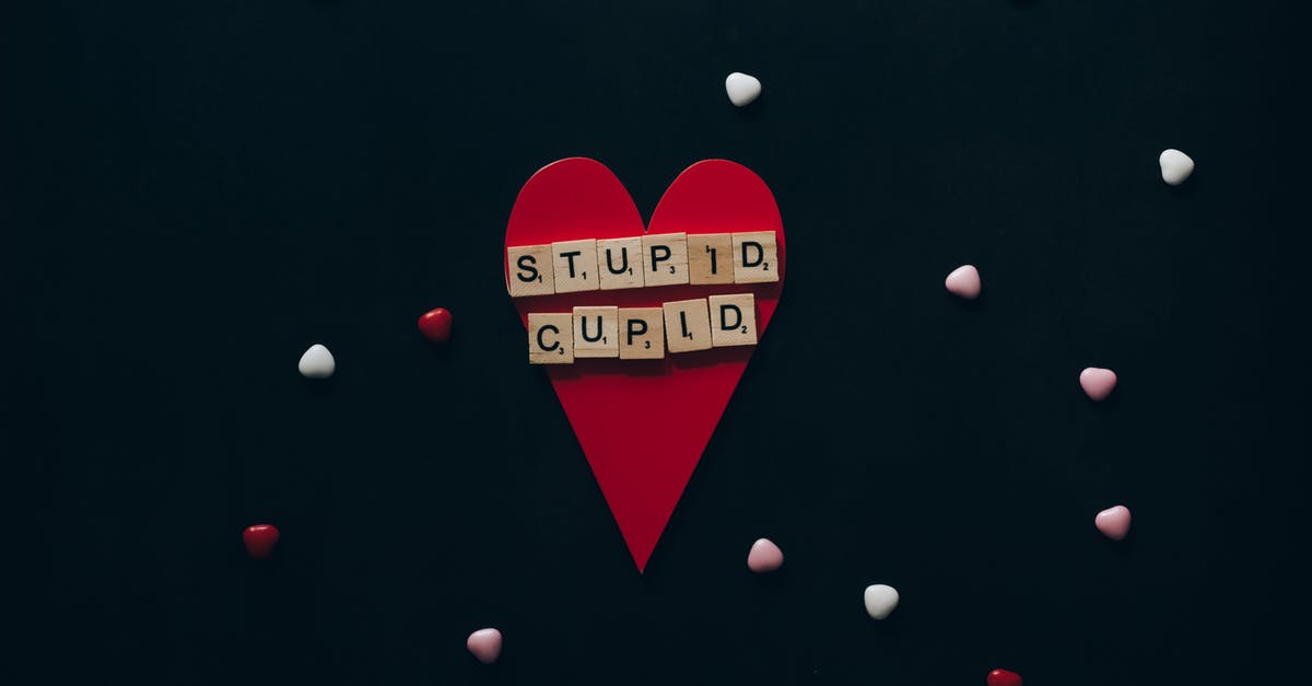 Can I refuse to answer stupid questions at immigration? [duplicate] - Wooden Scrabble Tiles on Red Paper Heart