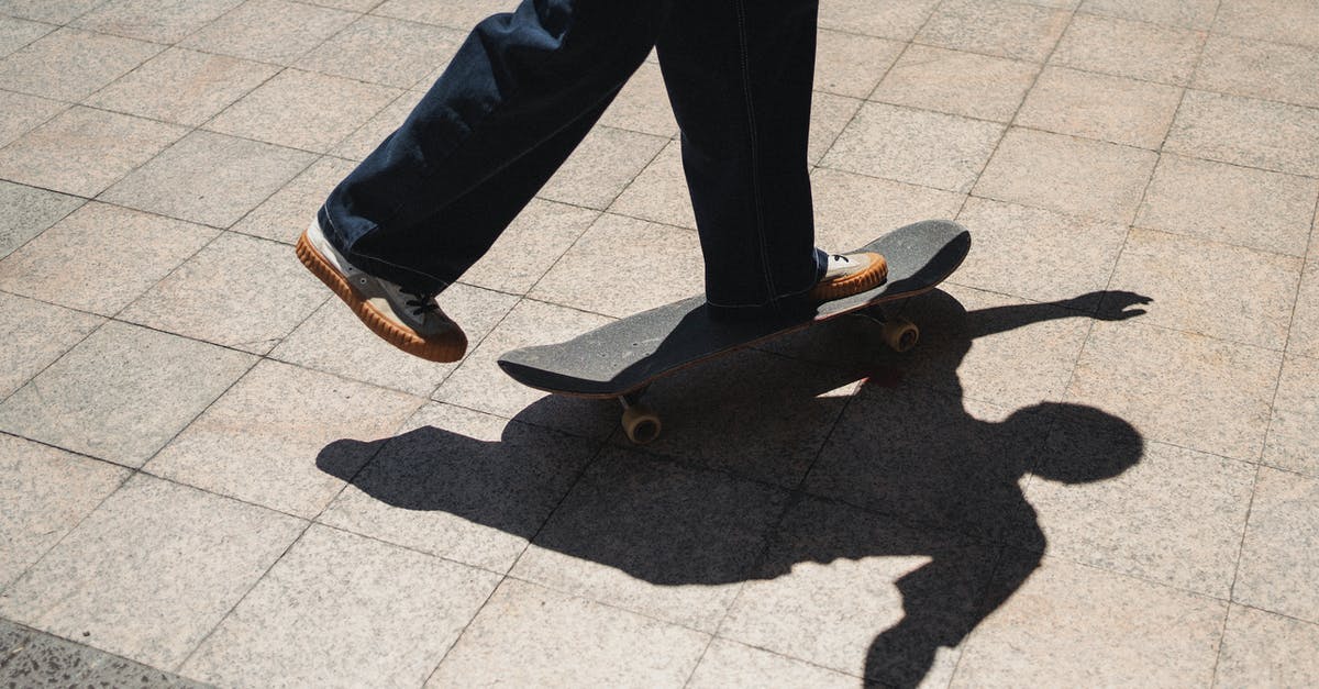 Can I roller skate on the street in France? - Crop skater riding skateboard on sidewalk