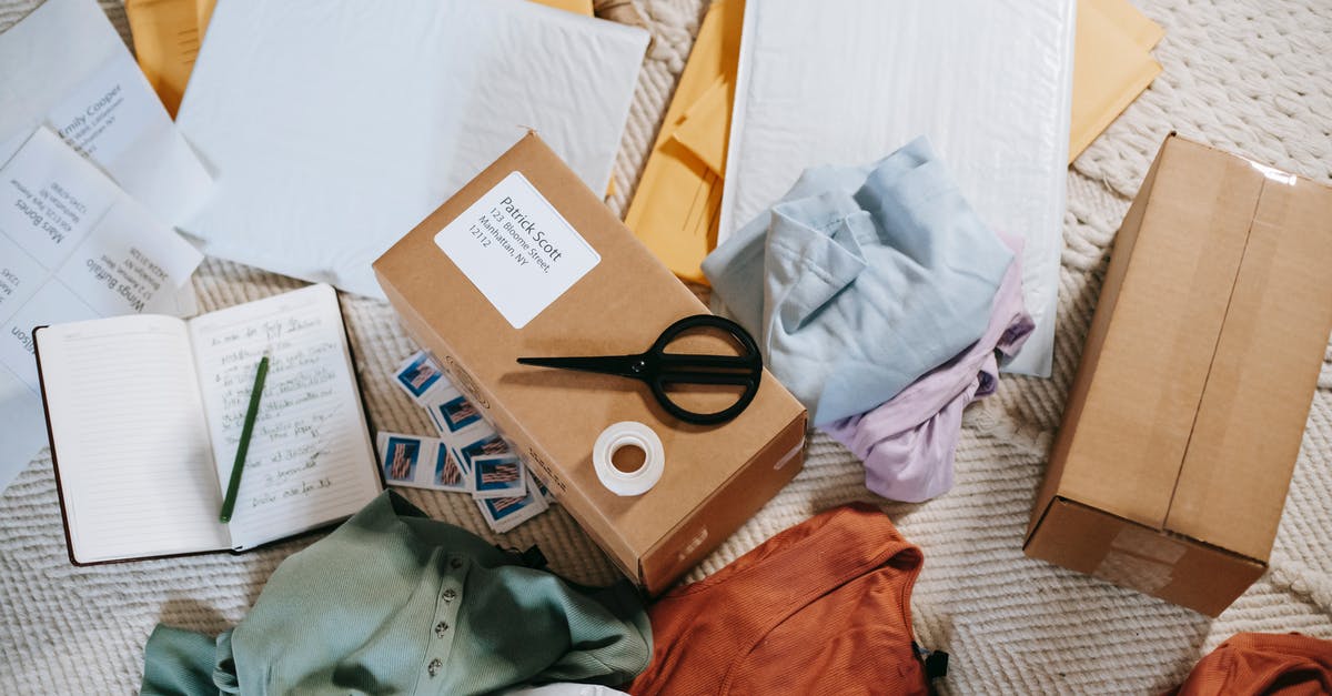 Can I send a different passport than I applied for the Canadian visa with? - From above of various carton boxes and labels near clothes on surface in room Can I send a different passport than I applied for the Canadian visa with? - From above of various carton boxes and labels near clothes on surface in room