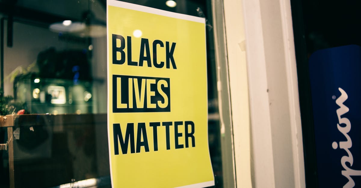 Can I skip the first part of a stop over? [duplicate] - Colorful yellow rectangular shaped signboard with inscription Black Lives Matter on glass door