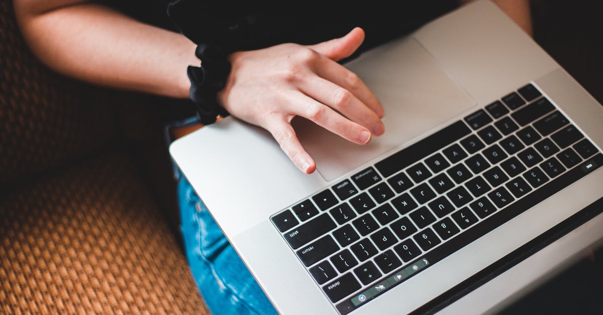 Can I submit Job offer letter as proof of employment? - Crop freelancer working on laptop on sofa