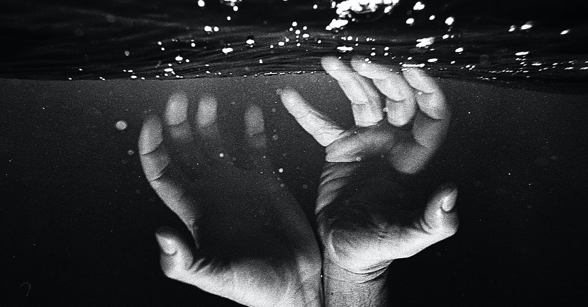 Can I swim to Litle Hjartøya from Nyholmen, Norway? - Hands of crop faceless man under water