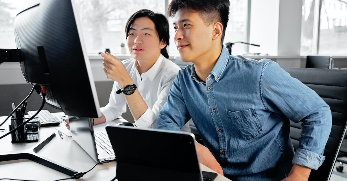 Can I take an AVR development board on a plane? - Employees Sitting on Swivel Chairs while Looking at the Monitor