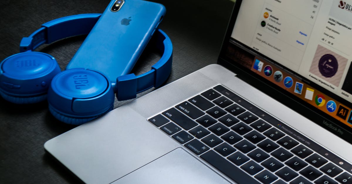 Can I take my Macbook Pro 2015 on my Aegean/Lufthansa flight? - Macbook Pro Beside Blue Wireless Headphones