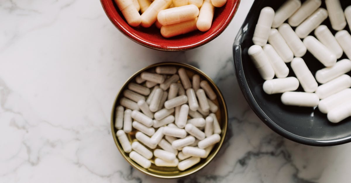 Can I take prescribed psychotropic Controlled drugs to UAE? - Black and Red Round Ceramic Bowl with Medicines