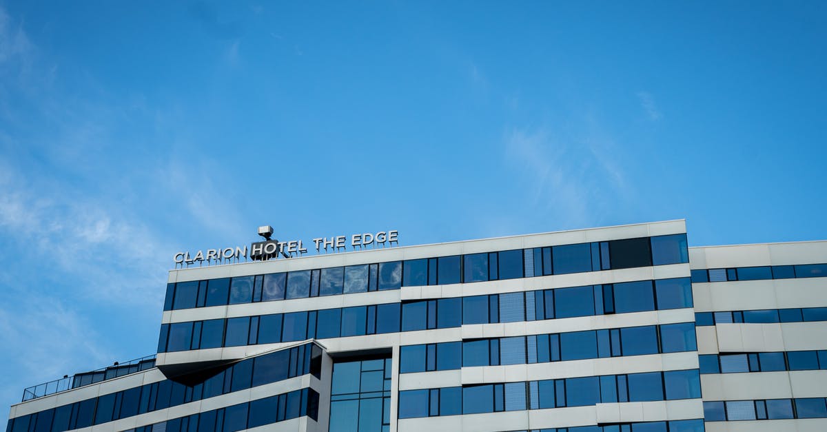 Can I transfer my hotel reservation? - White Concrete Building Under Blue Sky