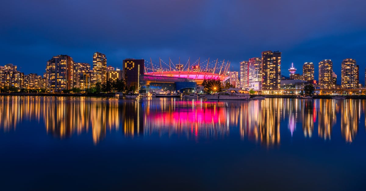 Can I transfer through Vancouver airport without Canada visa? Air Canada and Turkish Citizen [duplicate] - Long exposure panoramic shot from colorful downtown Vancouver at night