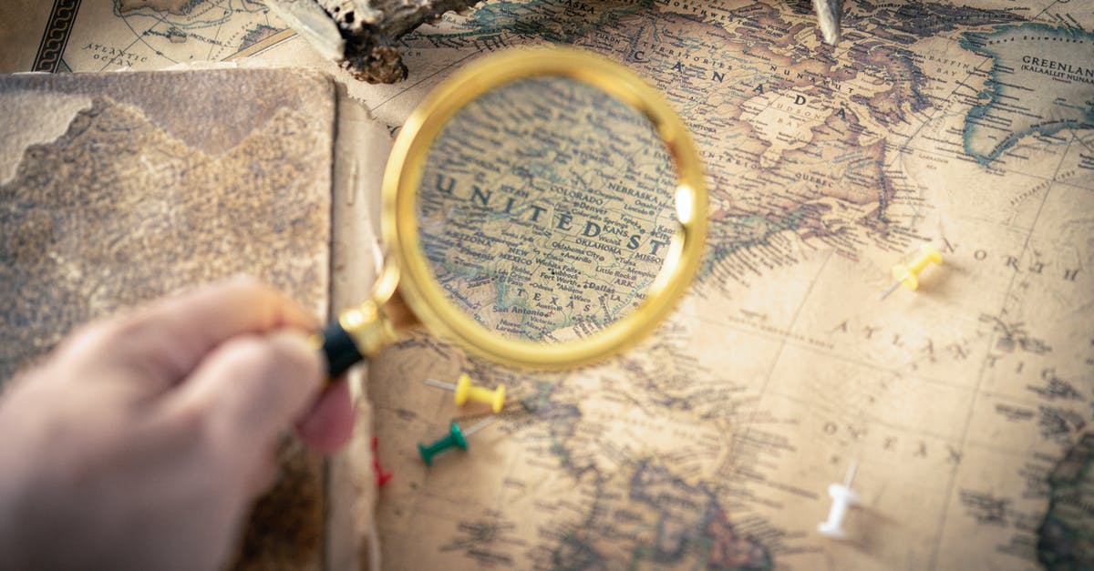 Can I travel to the US without holding a job? - Person Holding Magnifying Glass