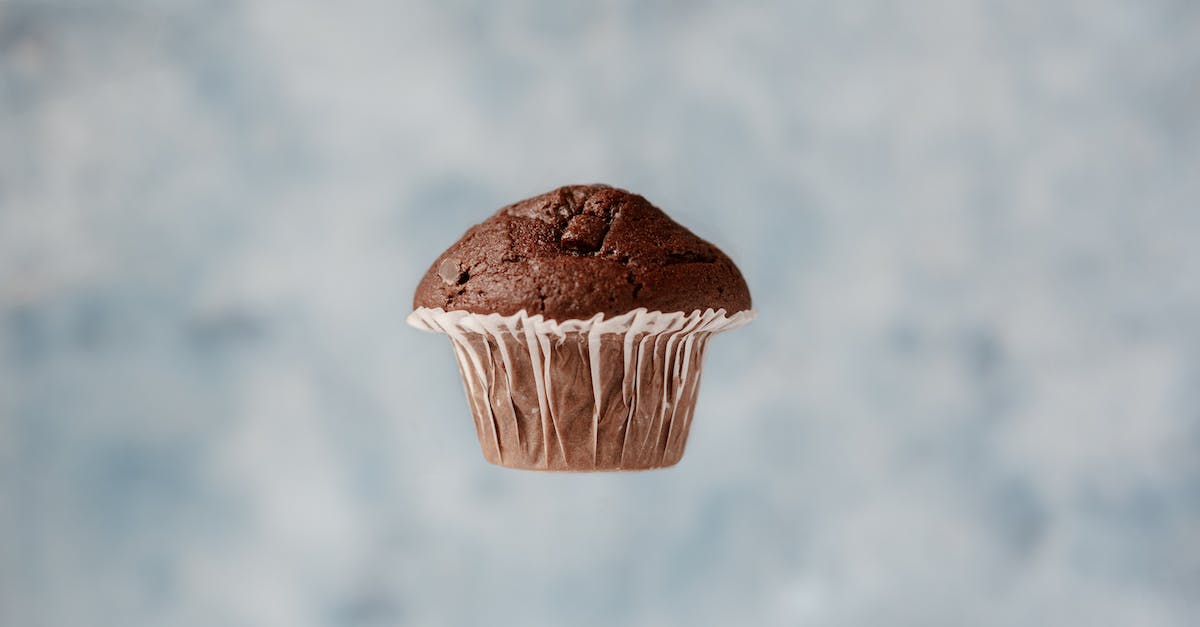 Can I upgrade only a portion of my ticket with miles on Singapore Air (SQ)? - Sweet chocolate muffin hanging in air on blurred background