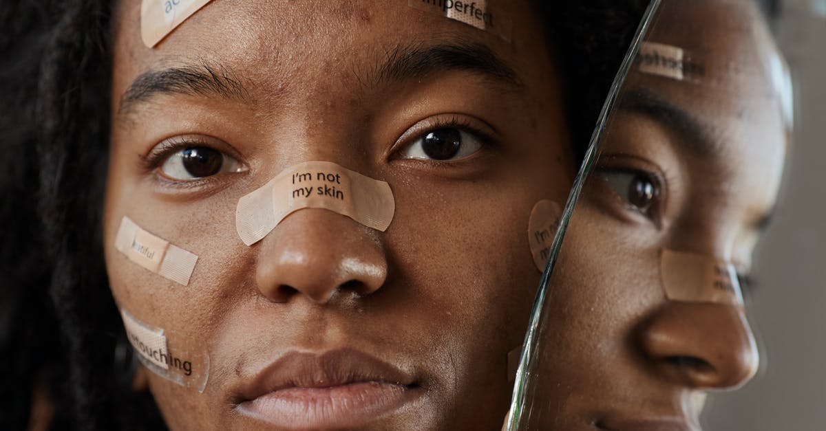 Can I use my foreign passport [closed] - A Woman Protesting with Messages on Band Aids 