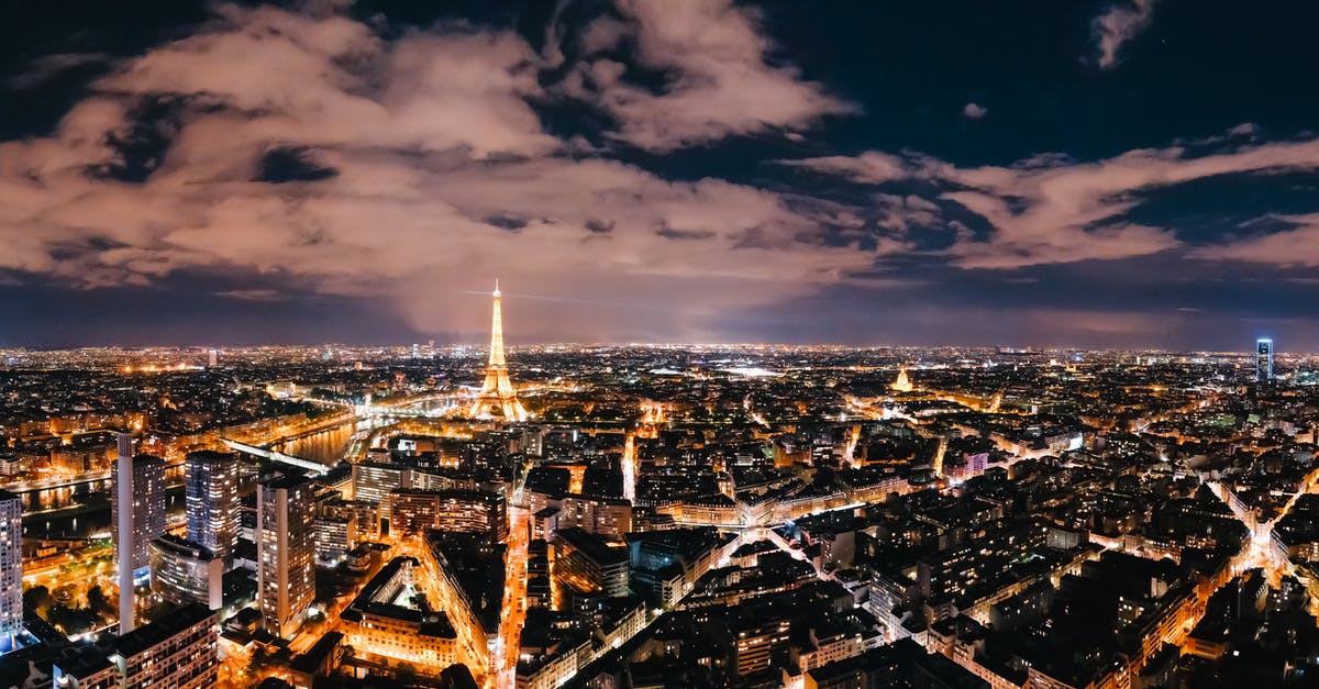 Can I use only buses in Paris instead of the Métro? - City With High Rise Buildings during Night Time