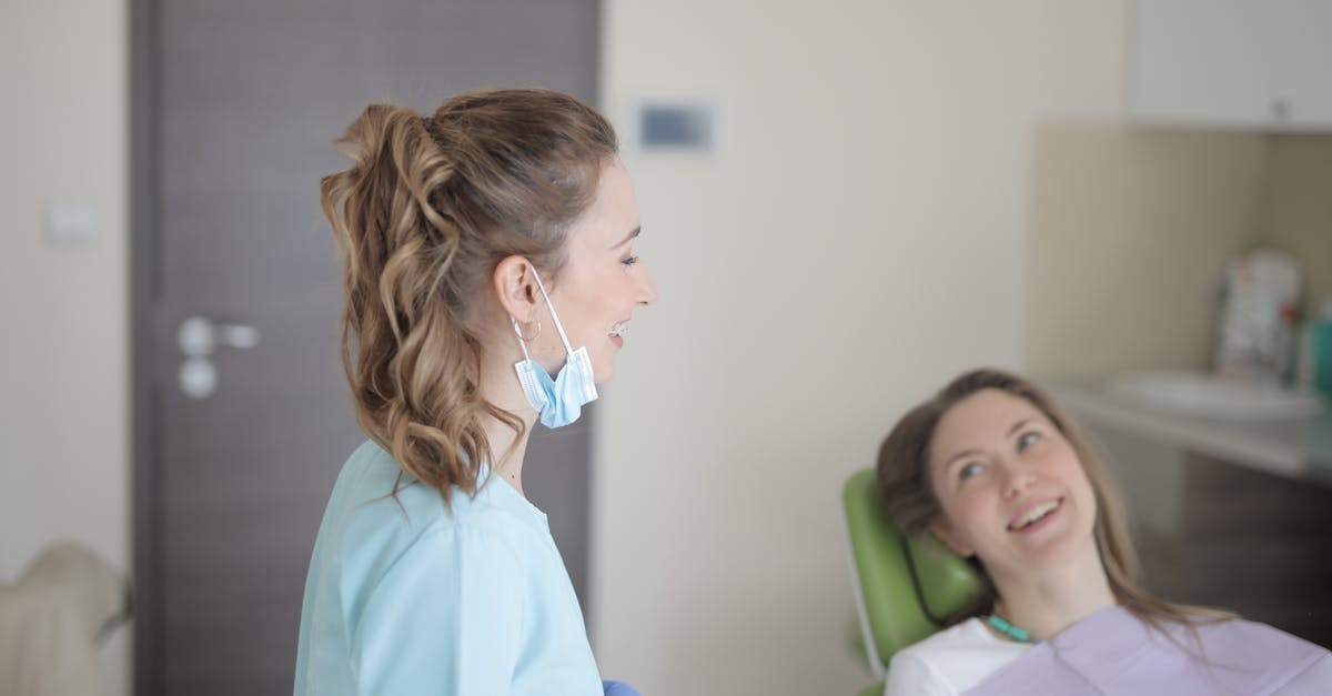 Can I visit other Schengen countries on a long-term Schengen visa or residency permit? - Cheerful young female dentist talking with patient in modern clinic
