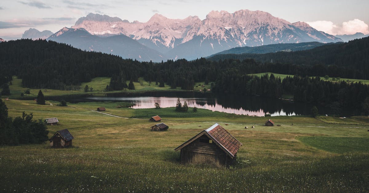 Can I visit the castles/fortresses in the mountains around Turin, Northern Italy? - Brown Wooden House on Green Grass Field Near Green Trees and Mountains