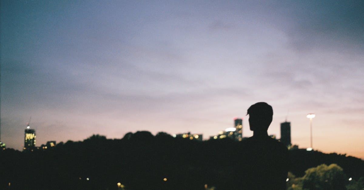 Can I walk around Easter Island alone at night? - Silhouette of man in darkness of city