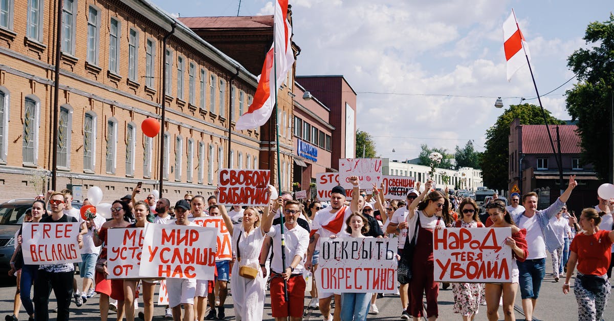 Can interpol detain me in the USA, Europe or Canada for dodging draft in countries like Russia, Belarus? - Protesters in Belarus