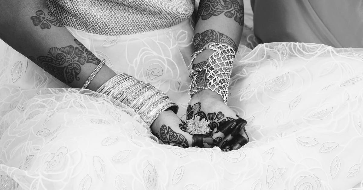 Can my brother photograph my wedding as a tourist? - Grayscale Photography of Woman With Henna Tattoo