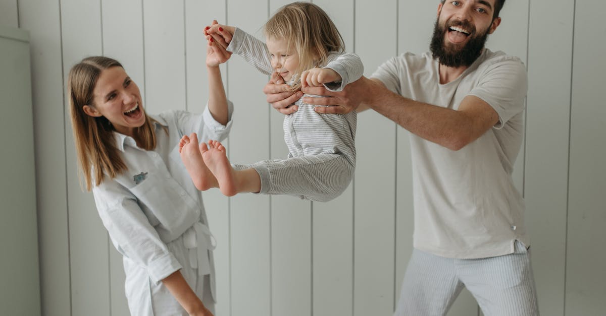 Can my father enter the UK as an EEA family member? - Man in White Shirt Holding Woman in White Shirt