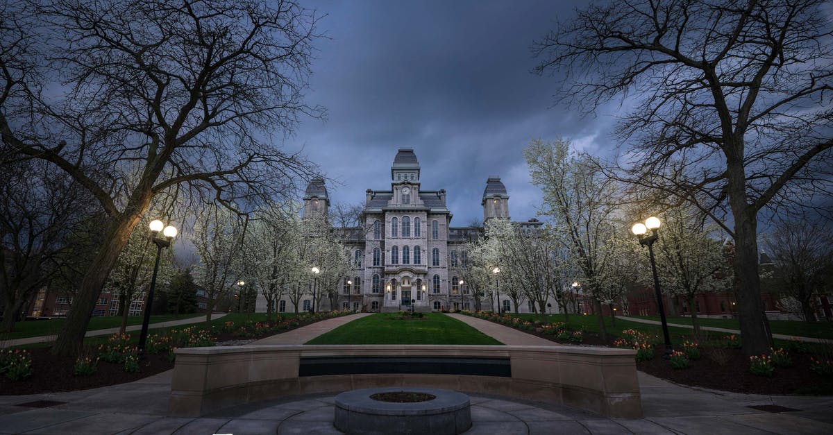 Can my UK university have my US visa cancelled? - Old building with ornamental facade in evening