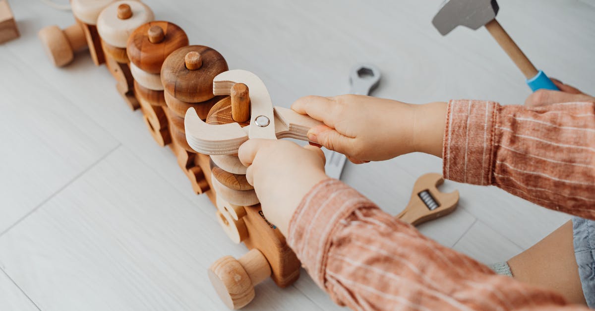 Can one take wooden toys to Australia? - Person Holding Brown Wooden Toy