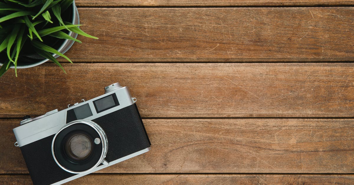 Can one travel with xerox copy of photo iD [duplicate] - Black and Silver Film Camera on Brown Wooden Surface