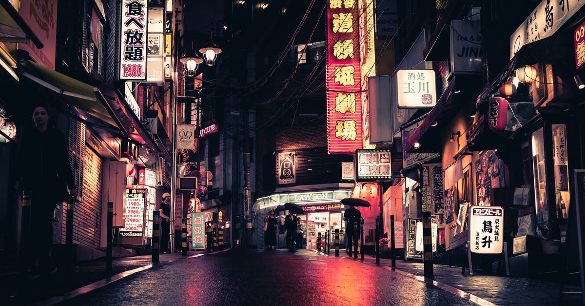 Can person take a toothpick from a restaurant in Japan? - People Walking on Street Near Buildings