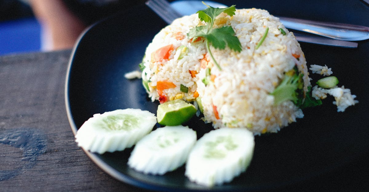 Can rice be brought into Hawaii? - White Rice With Green Leaf Vegetable on Blue Ceramic Plate