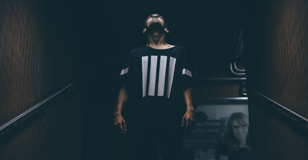 Can two people use one Pay-Per-Ride MetroCard in New York for one ride? - Man Standing on Stair Case Looking Up Can two people use one Pay-Per-Ride MetroCard in New York for one ride? - Man Standing on Stair Case Looking Up