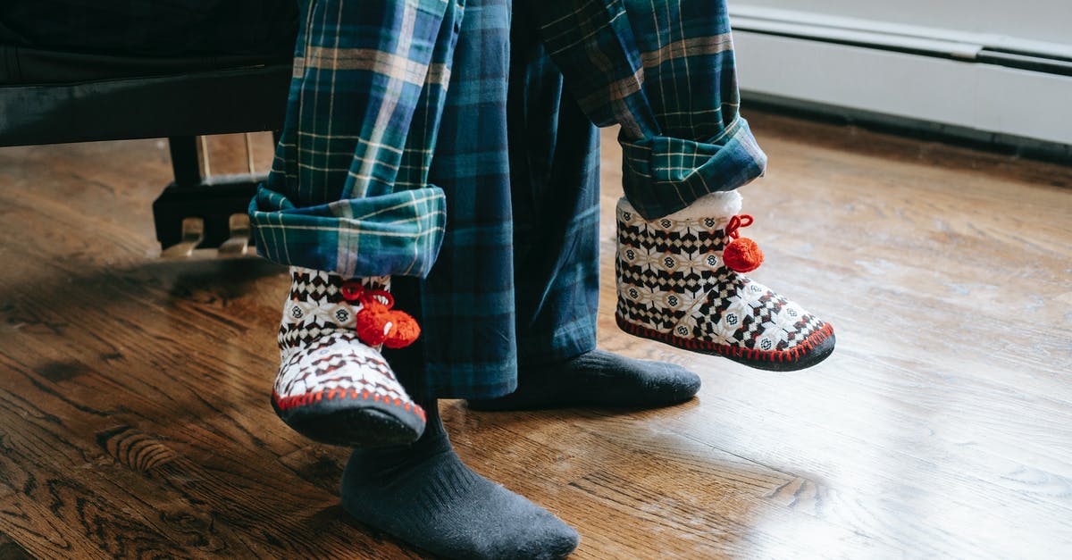 Can two visas be applied at the same time? - Crop father and child wearing soft same pajamas sitting together at daylight at home