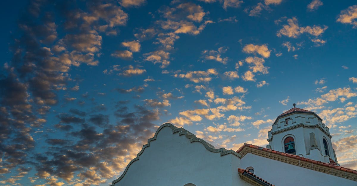 Can we round-trip travel to Brazil from the USA with our 5-month-old daughter using just her birth certificate? - Old building of train station with white walls and tiled roof at sundown