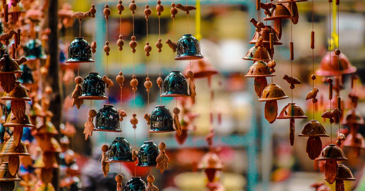 Can you buy duty free at Kuala Lumpur for travel to Australia? - Ornaments Hanging for Sale in Market