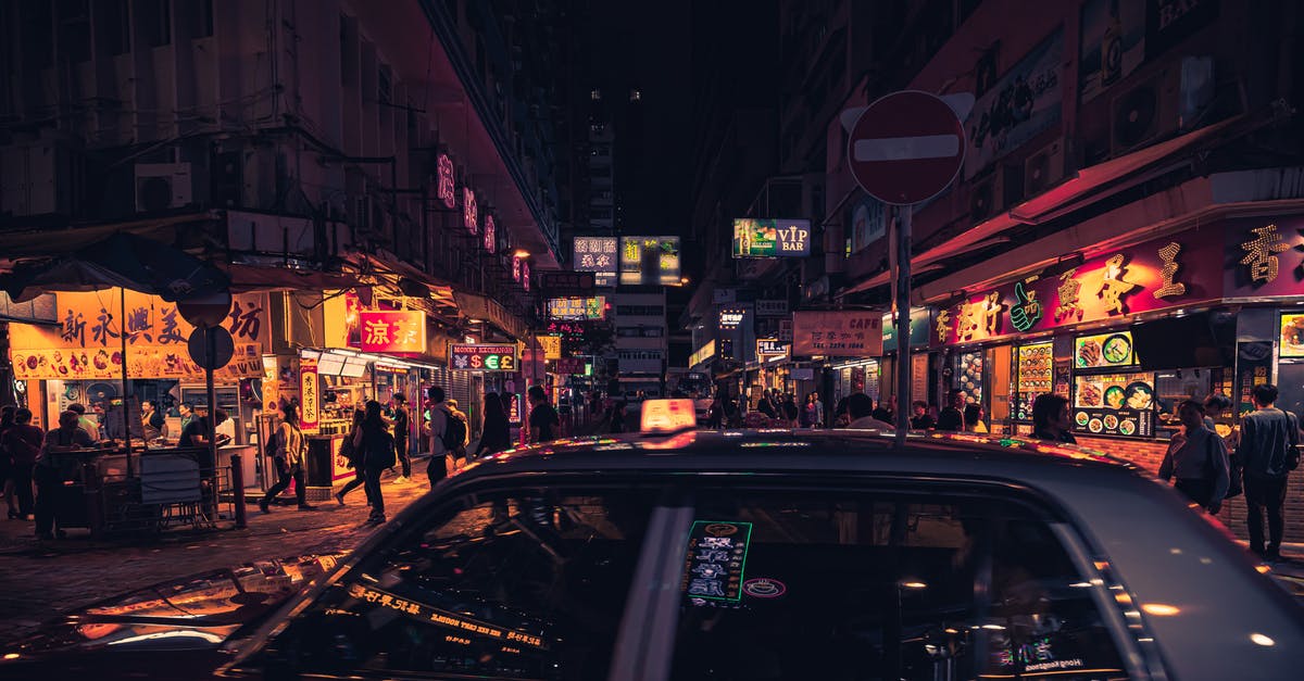 Can you drive from Hong Kong to Mumbai? - Photo of Taxi Near Buildings During Nighttime