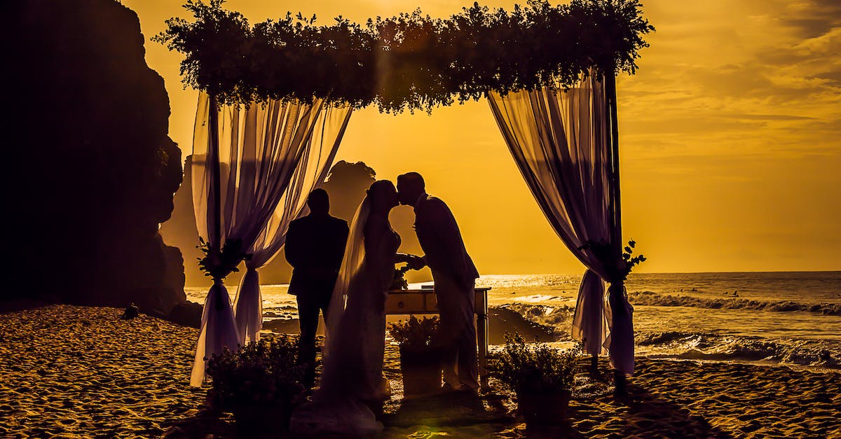 Can you get married while traveling? - Silhouette Photography of Newly Wed Kissing on Seashore