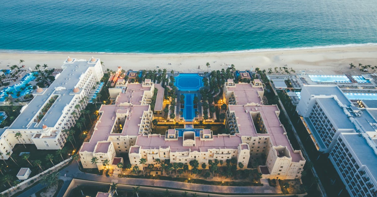 Can you hike from Cabo San Lucas to Lovers/Divorce beach? - Aerial View Of Hotel Buildings Near Sea