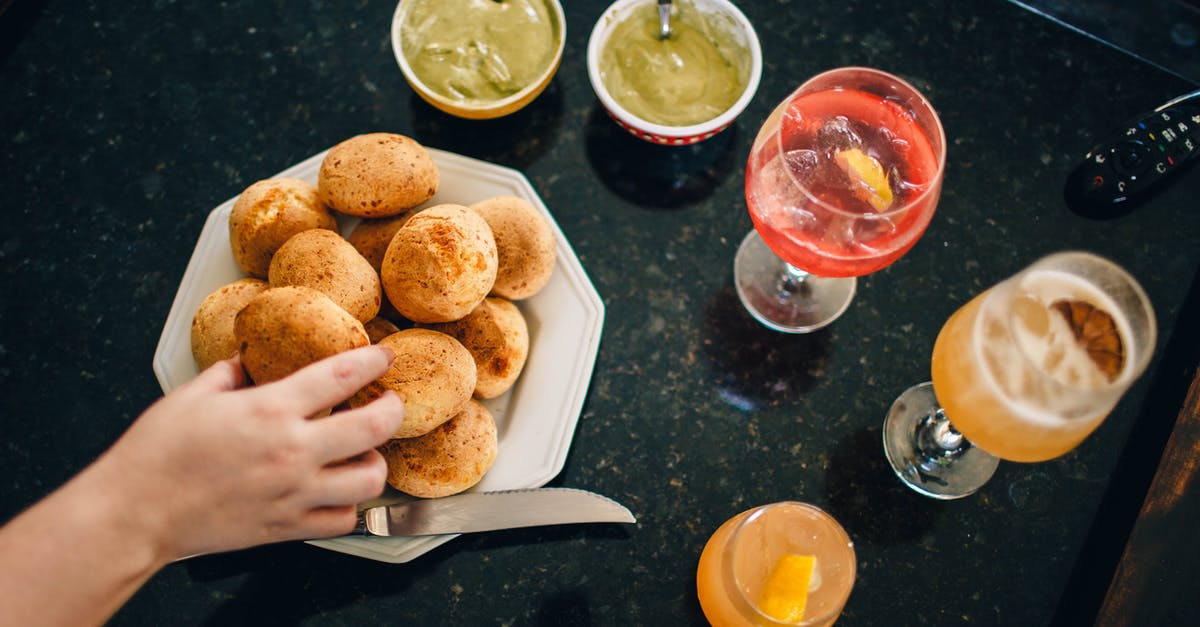 Can you take alcohol to Sri Lanka from Australia? - Crop person having buns with sauces and cocktails