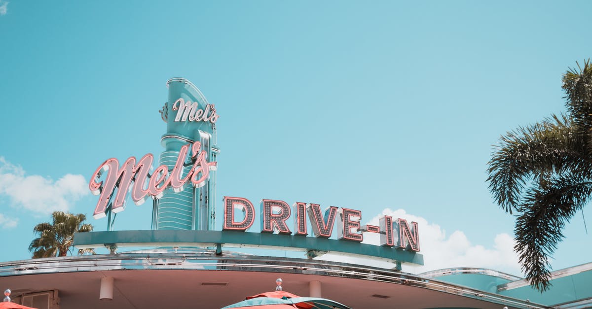 Can you take large umbrellas on a plane? - Mel's Drive-in Building Signage 