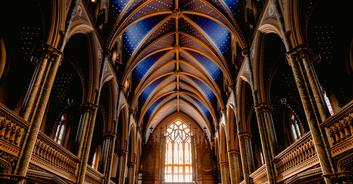 Can you travel to Canada if banned from the USA? - Interior of old Roman Catholic cathedral with wooden arched details