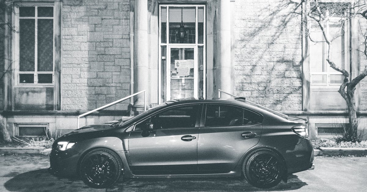 Canada: Entry by vehicle - Car parked near building in city