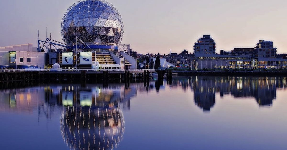 Canada Tourist Visa Application - Grey Dome Building Beside Body of Water during Sunset