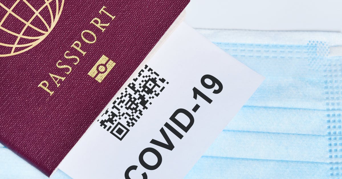 Canadian citizen traveling to USA on British Passport using ESTA - COVID-19 and travel concept, mark of coronavirus PCR testing in tourist Italian passport.Diagnostics of coronavirus in airport due to lockdown. Business and tourism hit by corona virus during