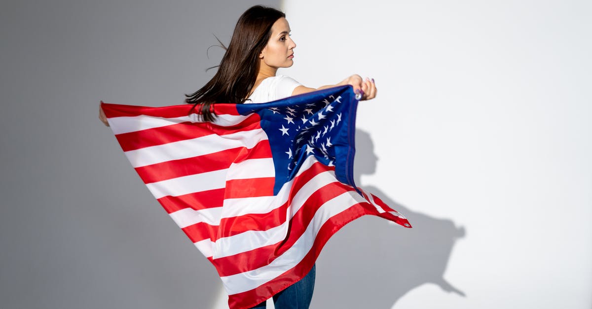Canadian stayed 6 months in US and left back to Canada. Want to go back to USA before 6 months of being away from USA passed - Woman With an American Flag