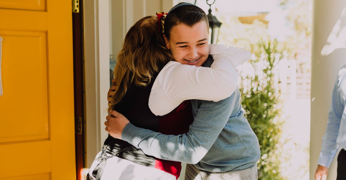 Canadian visitor after a working holiday visa - Photo Of People Hugging Each Other In Front Door