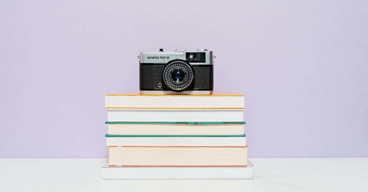 Cancellation fee on failed booking [closed] - White and Black Camera on Stack of Books