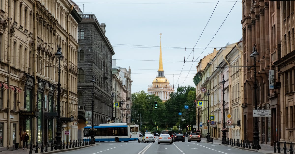 Cancelled unused Russian tourist visa - Cars on Road Between Buildings