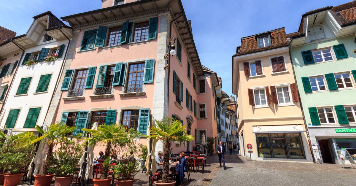 Cancelling apartment booking in Switzerland - City Buildings on a Sunny Day