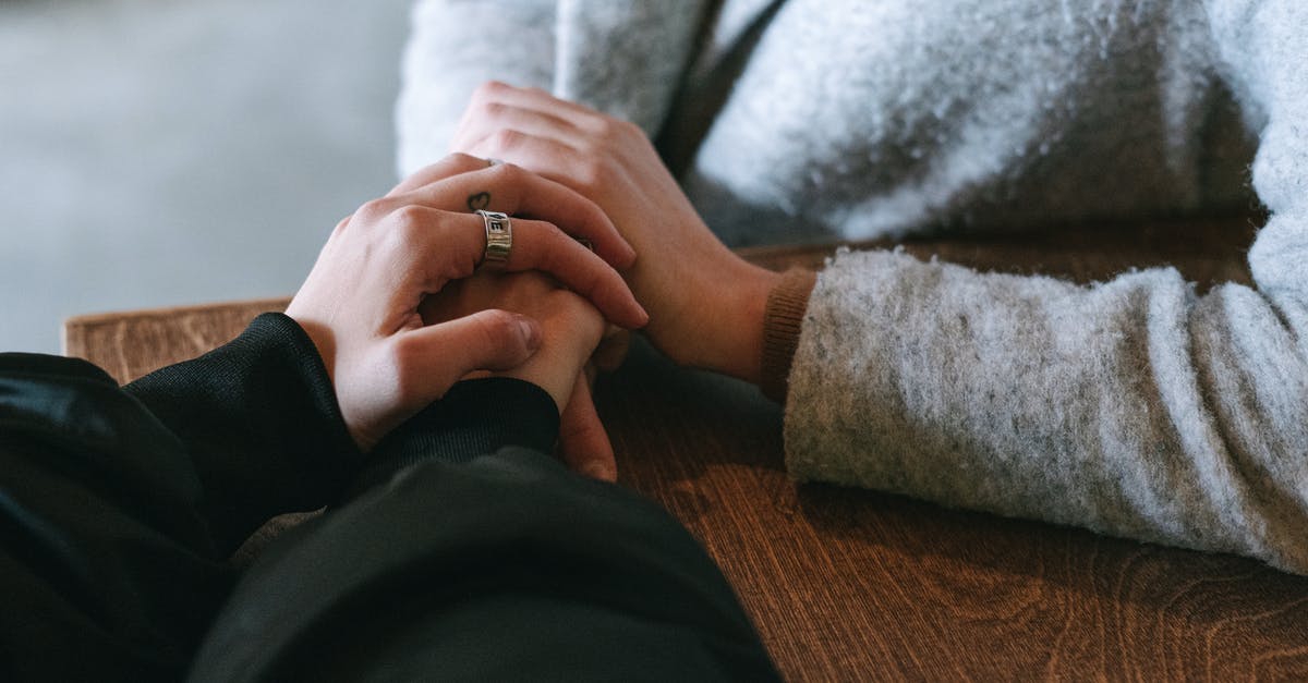 Cancer Survivor Family Friend Visiting UK - Person in Black Long Sleeve Shirt and Silver Ring